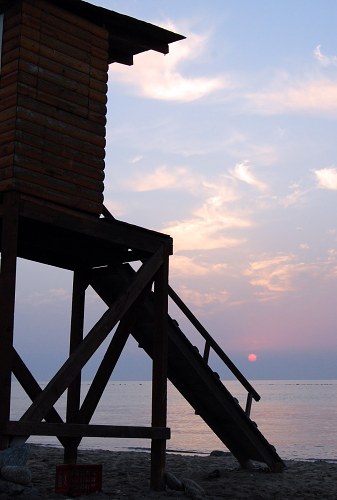 Lifeguard tower at sunrise free photo